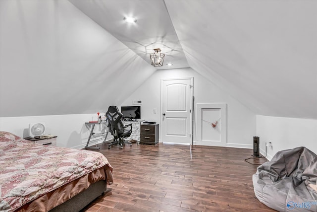 bedroom featuring lofted ceiling, baseboards, and dark wood-style flooring