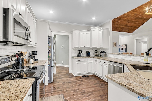 kitchen featuring white cabinetry, crown molding, appliances with stainless steel finishes, and a sink