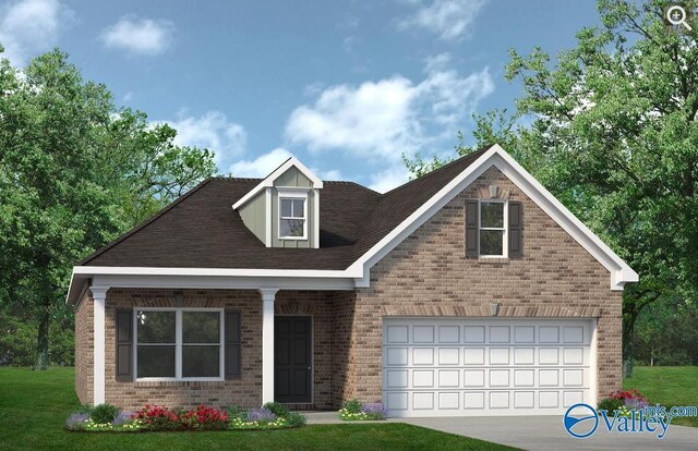 view of front of home with a garage and a front yard