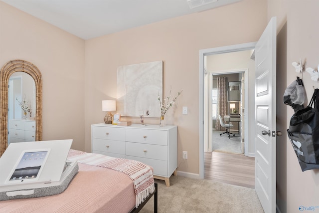 bedroom with light carpet