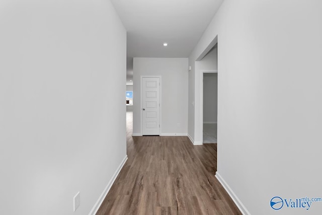 corridor featuring hardwood / wood-style floors