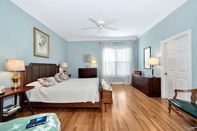 bedroom with ornamental molding, light hardwood / wood-style floors, and ceiling fan