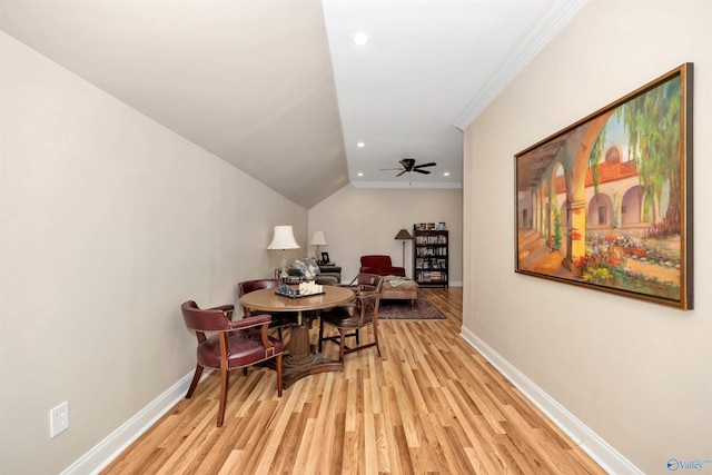 dining space with ceiling fan, ornamental molding, and light hardwood / wood-style floors