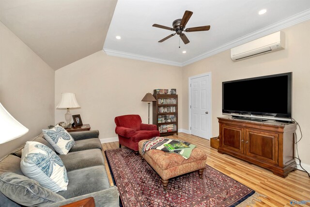 living room featuring lofted ceiling, crown molding, ceiling fan, light hardwood / wood-style floors, and an AC wall unit