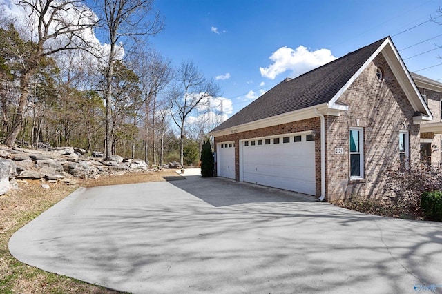 view of side of home featuring a garage