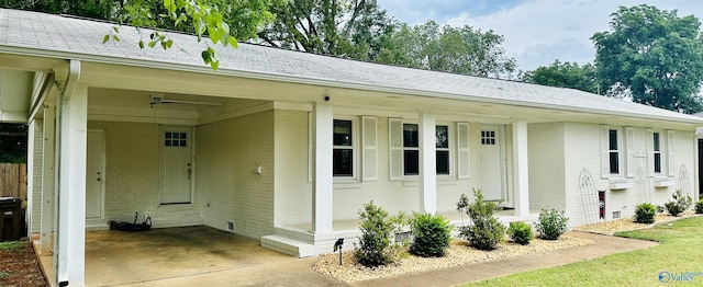 exterior space featuring a carport