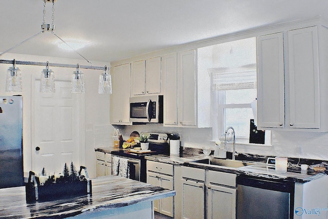 kitchen with sink, stainless steel appliances, and white cabinetry