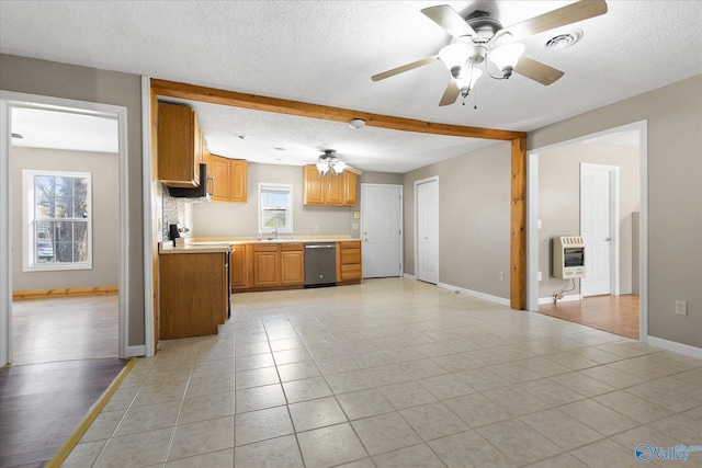 kitchen featuring dishwasher, ceiling fan, a textured ceiling, light tile patterned flooring, and heating unit