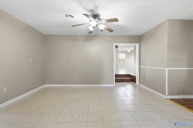 empty room featuring a textured ceiling