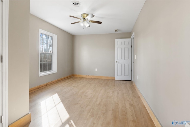 empty room with light hardwood / wood-style floors and ceiling fan