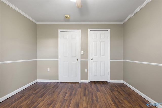 unfurnished bedroom with dark hardwood / wood-style flooring, ceiling fan, and crown molding