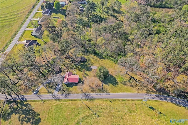 birds eye view of property with a rural view