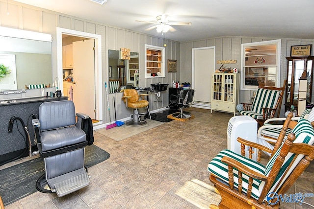 interior space with ceiling fan and lofted ceiling