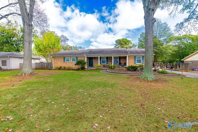 ranch-style house with a front yard