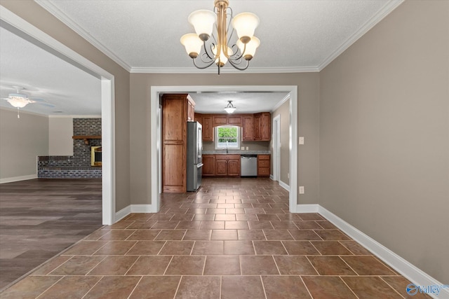 unfurnished dining area with a brick fireplace, baseboards, and ornamental molding