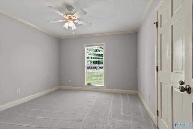 unfurnished room with a textured ceiling, ornamental molding, and ceiling fan