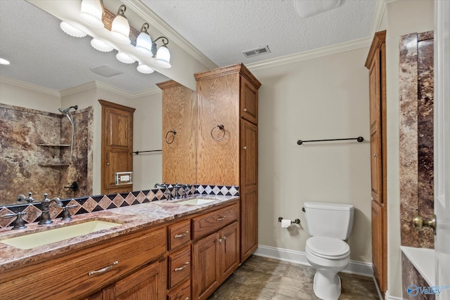 bathroom featuring backsplash, visible vents, toilet, and a sink
