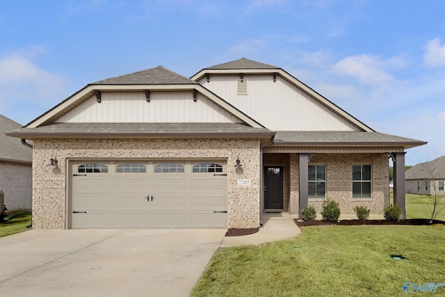 view of front of home featuring a garage and a front lawn