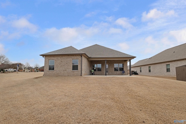 back of property with a patio