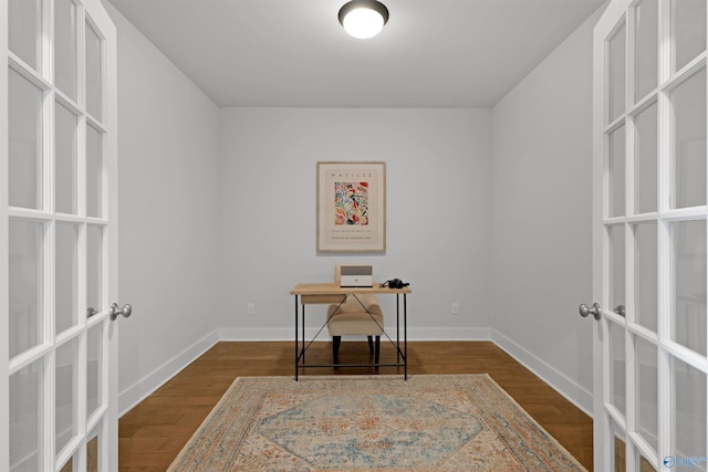 home office featuring dark hardwood / wood-style flooring and french doors