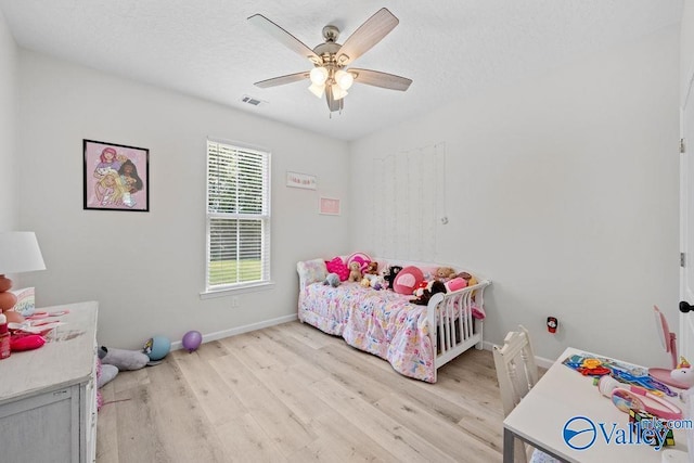 bedroom featuring ceiling fan and light hardwood / wood-style flooring