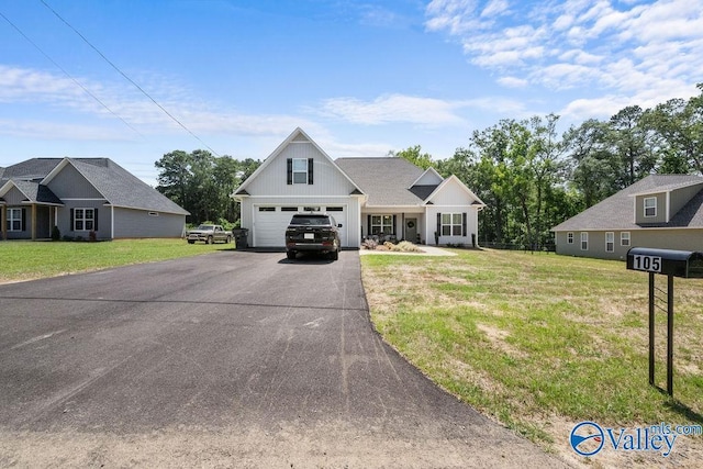 view of front facade featuring a garage and a front lawn