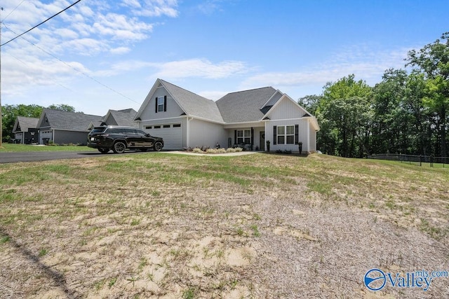 view of front of house with a garage and a front yard