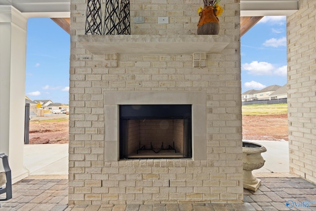 exterior details with an outdoor brick fireplace