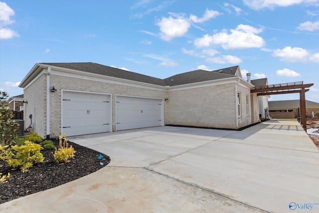 view of side of property with a garage