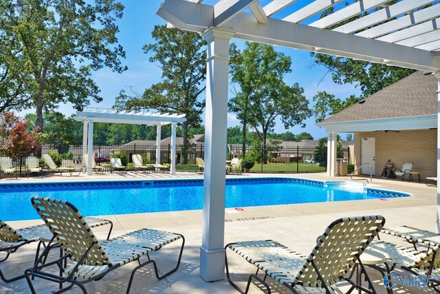 view of swimming pool featuring a pergola and a patio