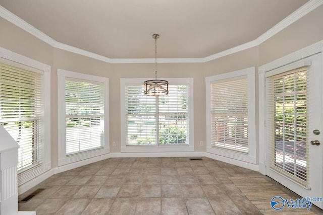 unfurnished dining area with ornamental molding, light tile patterned flooring, and a wealth of natural light