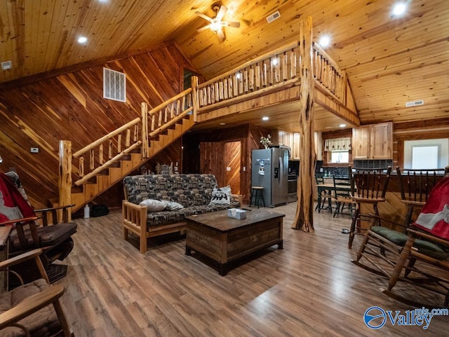 living room featuring ceiling fan, high vaulted ceiling, wooden ceiling, and hardwood / wood-style floors