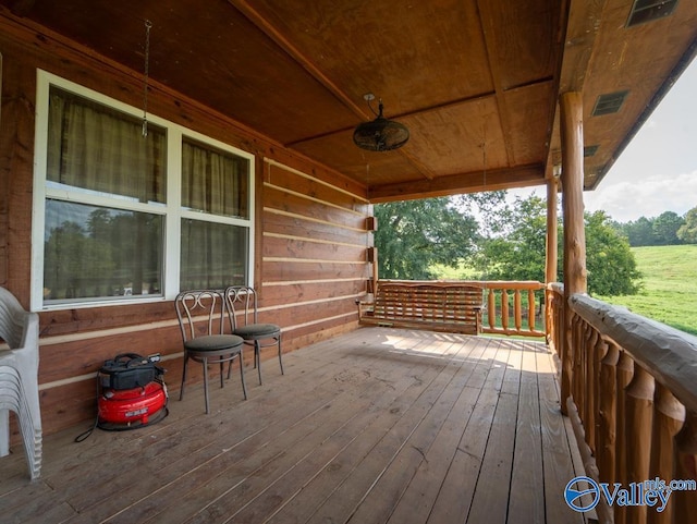 wooden terrace with ceiling fan