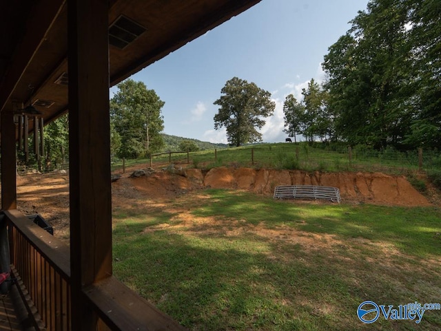 view of yard with a rural view