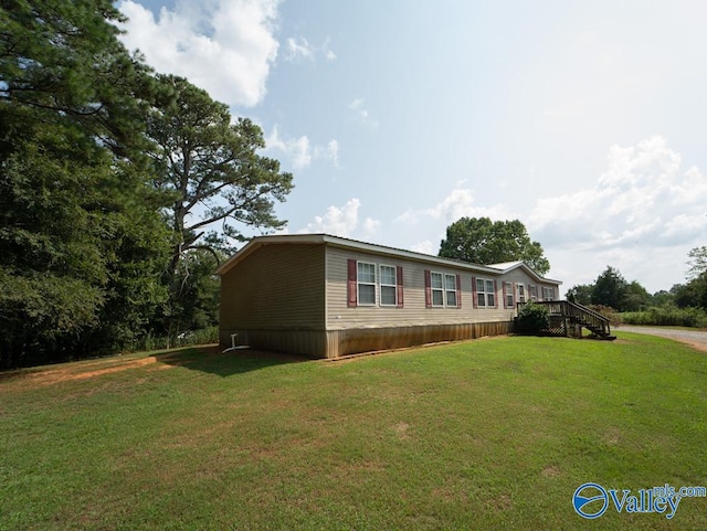 view of home's exterior featuring a yard