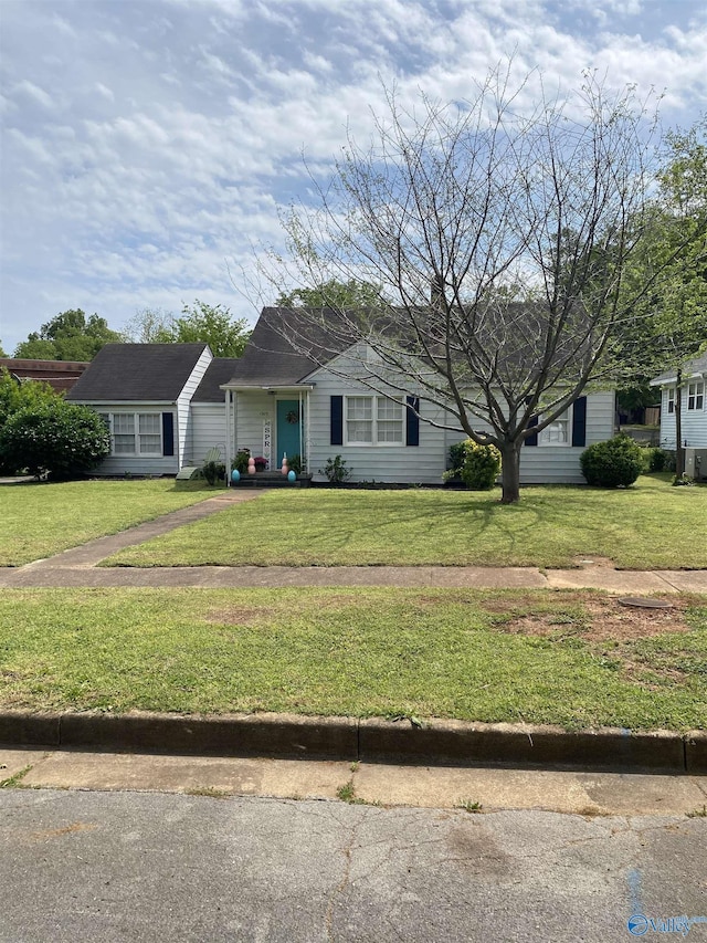 ranch-style house with a front lawn