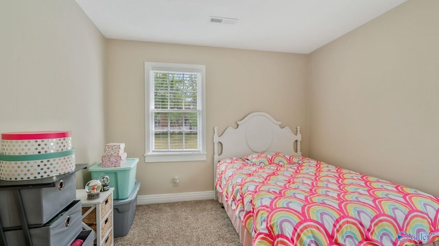 bedroom with carpet, visible vents, and baseboards