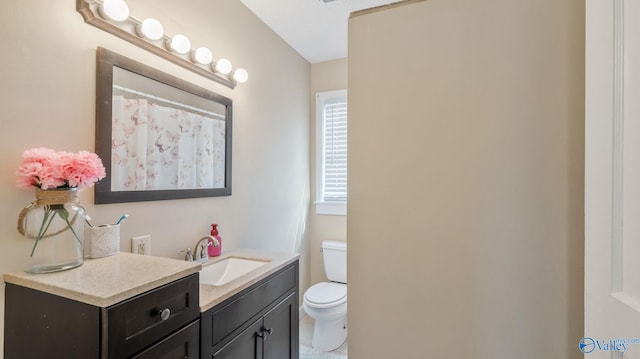 bathroom with vanity and toilet