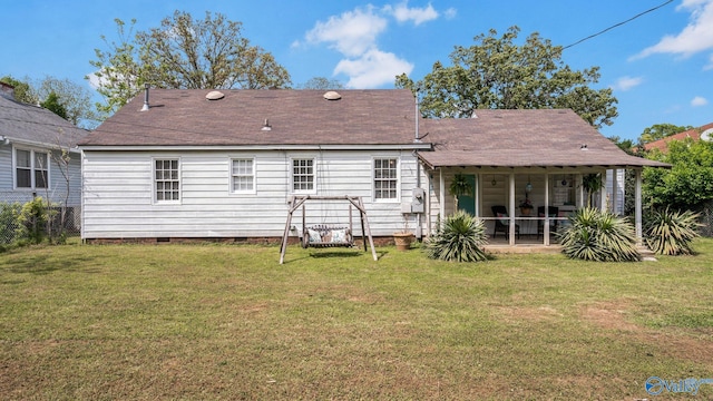 rear view of house with a yard, crawl space, a patio, and a shingled roof