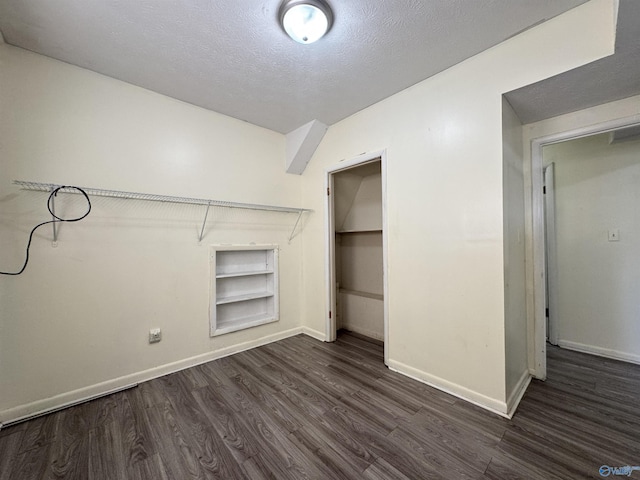 walk in closet featuring dark hardwood / wood-style floors