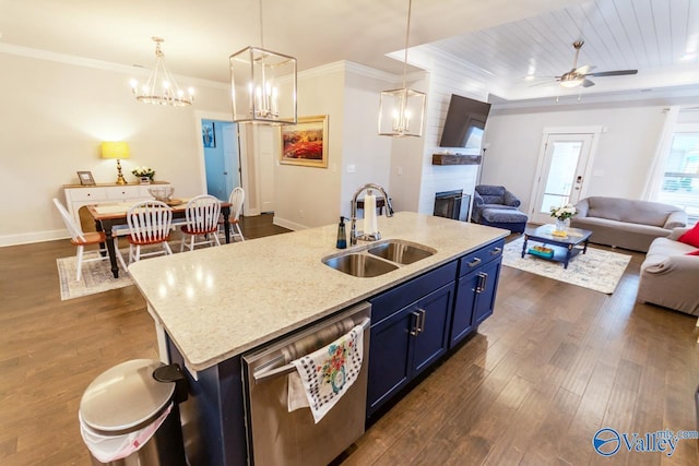 kitchen with a kitchen island with sink, sink, stainless steel dishwasher, a large fireplace, and dark hardwood / wood-style flooring