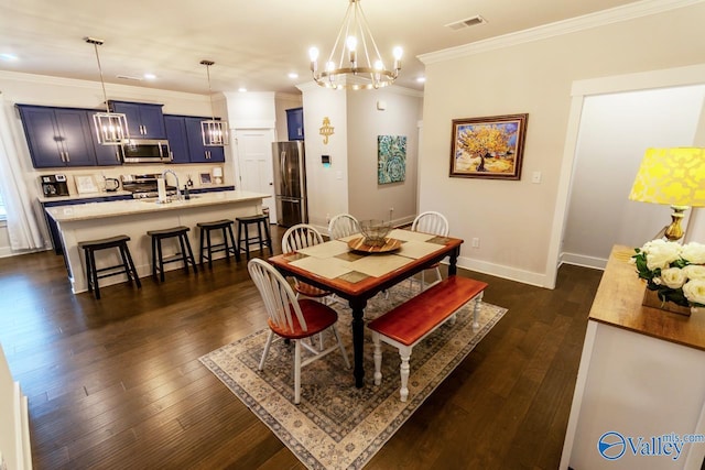 dining area featuring ornamental molding, an inviting chandelier, and dark wood-type flooring