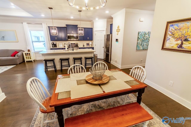 dining area featuring dark hardwood / wood-style floors and ornamental molding