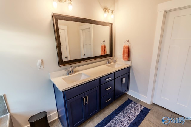 bathroom with tile patterned floors and vanity