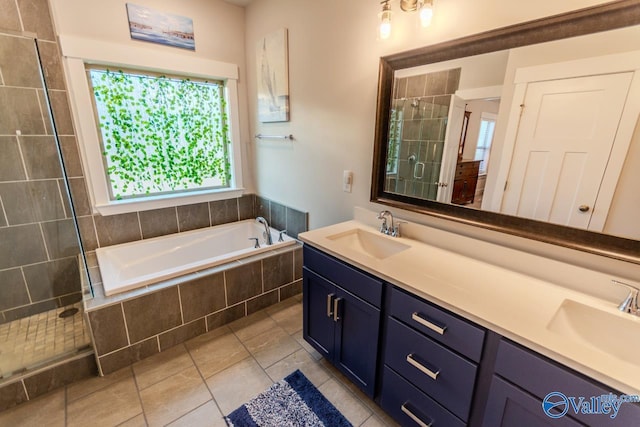 bathroom featuring tile patterned flooring, vanity, and plus walk in shower