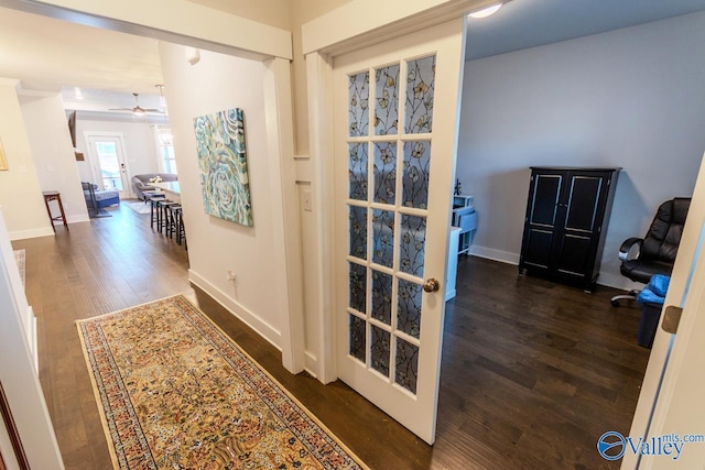 hallway featuring dark hardwood / wood-style flooring