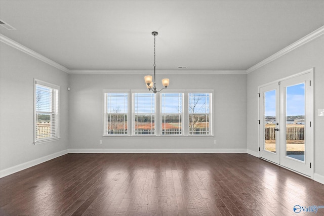 unfurnished dining area with a notable chandelier, dark wood-type flooring, and ornamental molding