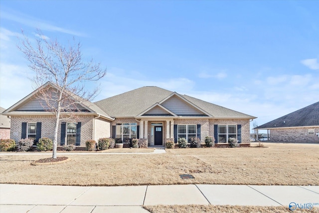 craftsman-style house with a front yard