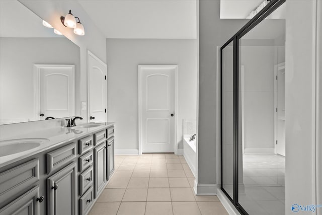 bathroom featuring vanity, tile patterned floors, and separate shower and tub