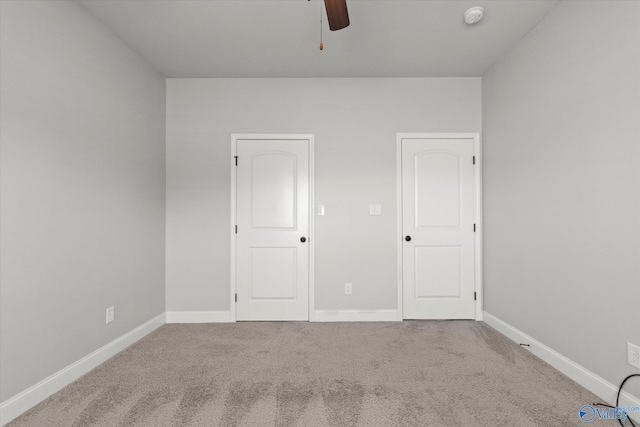 unfurnished bedroom with carpet flooring and ceiling fan